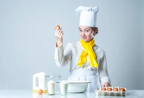 Cook breaking egg Stock Photos