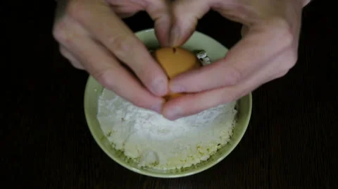 The cook breaks egg in a flour Video stock 66152235