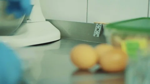 Cook breaks eggs and separates yolk Stock Footage 89846286