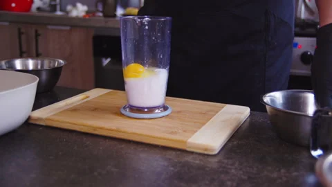 The cook breaks eggs for cooking Stock Footage 307312684