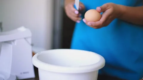 The cook breaks eggs for the dough Stock Footage 65947654