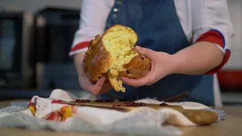 The cook breaks fresh bread, there is a beautiful steam. Stock Footage 159366089
