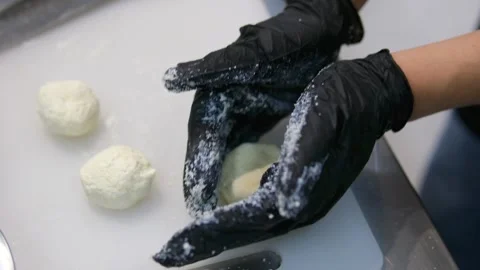 Cook buns form pancakes baking dough gloves in flour curd baking Video stock 287999612