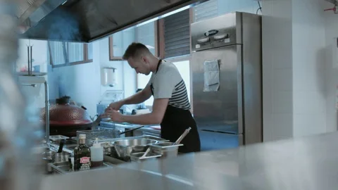 Cook / Chef Preparing Potatoes To Be Thrown Into A Deep Freyer Stock Footage 95151134