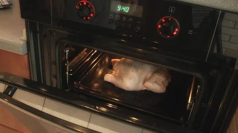 Cook the chicken in the oven sends Stock Footage 47073632