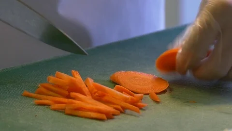 Cook chopped carrots Stock Footage 72565590