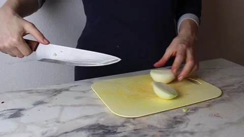 The cook chops a red apple into pieces on a cutting board. Preparation of salad	 Stock-Footage 304272610