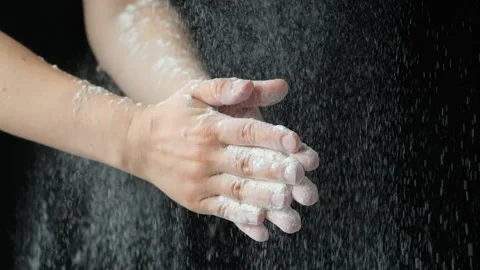 Cook clapping his hands with flour, flour splash slow motion Video stock 288194320