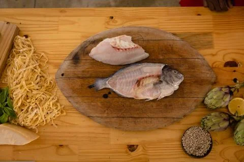 Cook cooking a fish Stock Photos