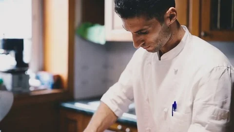 Cook cooks in the kitchen Stock Footage 81543627