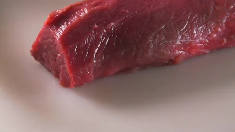 Cook cooks meat Stock Footage 83345819