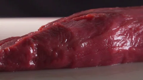 Cook cooks meat Stock Footage 83346148