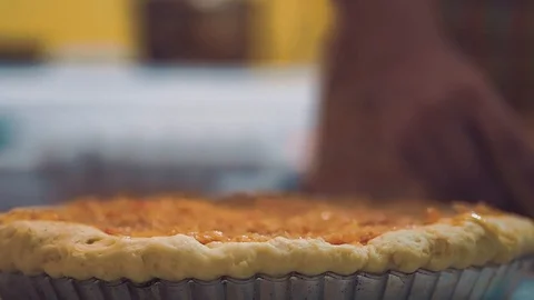 The cook covers a pie basis with the second layer. Stock Footage 102443198