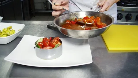 The cook creates a dish in the kitchen Stock Footage 80047331