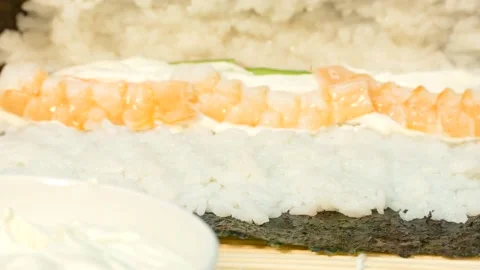 Cook curls sushi roll with stuffing Stock Footage 88499339