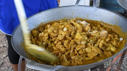 To cook curry paste in a boiling pan part 2 Stock Footage 130139032