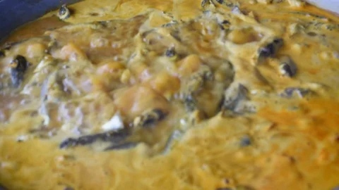 To cook curry paste in a boiling pan Stock Footage 130139034