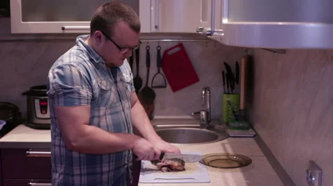 Cook cut the fish into steaks Stock Footage 59634468