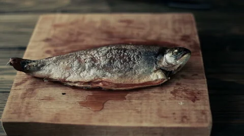 Cook cut up fried fish Stock Footage 49829372