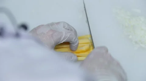 Cook is cuting vegetables on the cutting board 스톡 동영상 48395756