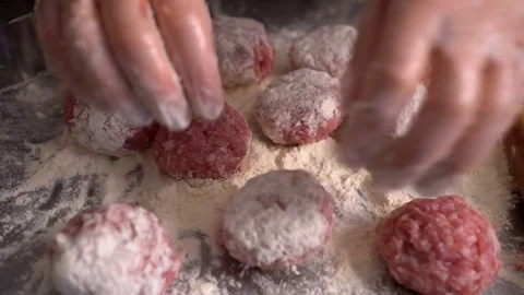Cook cutlets raw flour. Hands cook in transparent gloves. Stock Footage 107619469