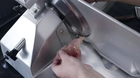 The cook cuts the bacon into thin slices and puts it on the pizza Stock Footage 200204216
