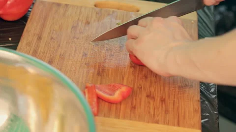 Cook cuts bell pepper for salad Stock Footage 54457316
