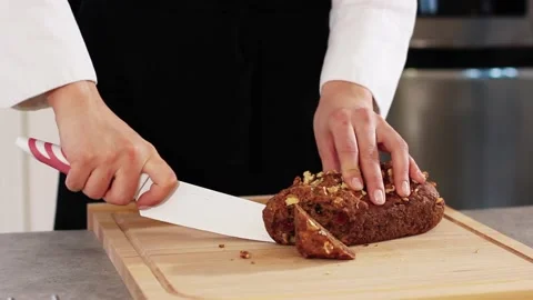 The cook cuts black bread 스톡 동영상 211600478