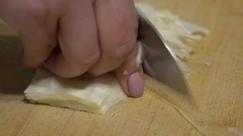 Cook cuts cabbage Stock Footage 164473296