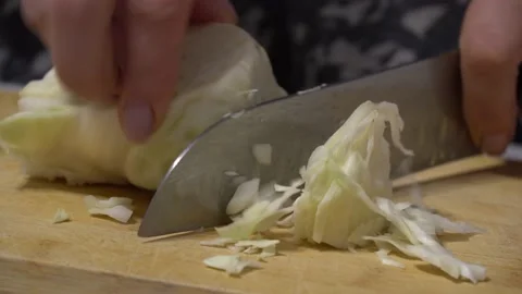 Cook cuts cabbage Stock Footage 164473298