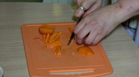 The cook cuts carrots. 4K. Stock Footage 59841786