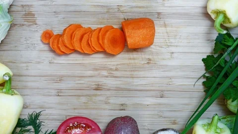 Cook cuts carrots Stock Footage 78057384