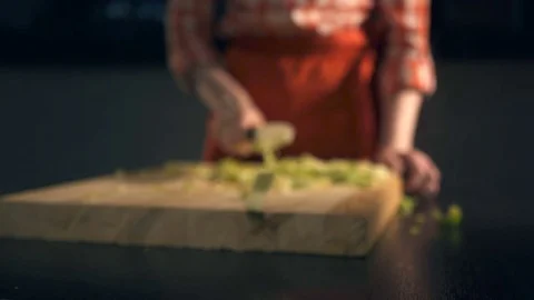 The cook cuts celery. Slow Motion Stock Footage 74408832