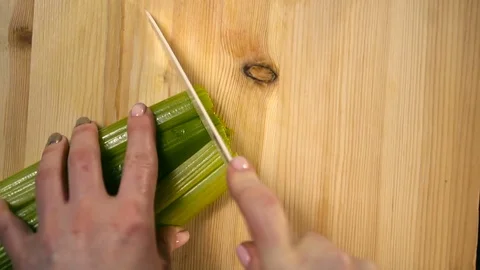 The cook cuts celery. Slow Motion Stock Footage 74408845