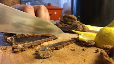 Cook cuts corned beef on wooden board Stock Footage 106575232