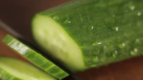 Cook cuts cucumbers close-up Video stock 77364665
