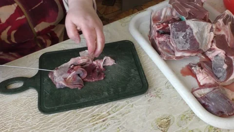 The cook cuts deer meat with a knife. healthy food concept 스톡 동영상 149004764