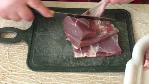 The cook cuts deer meat with a knife. healthy food concept 스톡 동영상 149005513