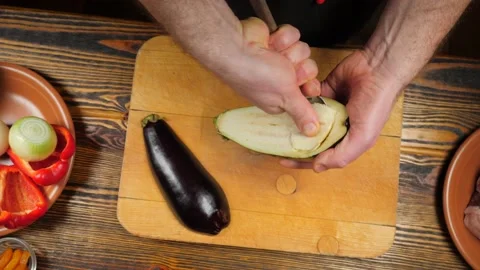 Cook cuts eggplant. Top view Video stock 233258481