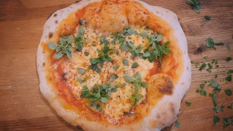 Cook cuts fragrant pizza with roller knife in restaurant Stock Footage 127214984