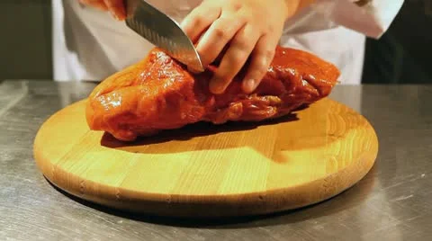 Cook cuts the ham Stock Footage 8981817