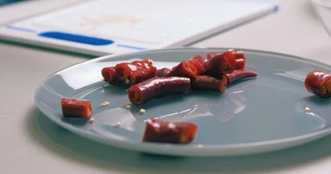 Cook Cuts Hot Red Fresh Chili Peppers On A Cutting Board With A Knife Stock Footage 128096355