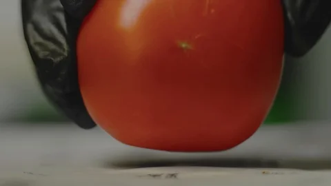 The cook cuts the knife red tomato Stock Footage 102510167