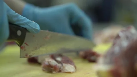 The cook cuts the meat Stock Footage 156337407