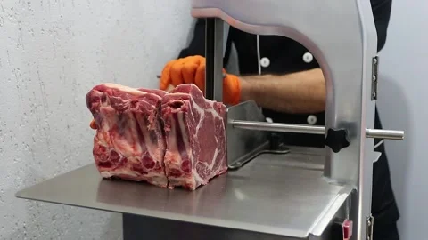 The cook cuts the meat on the kitchen board Stock Footage 201325209
