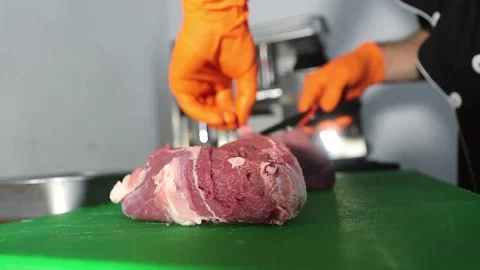 The cook cuts the meat on the kitchen board Stock Footage 201325246