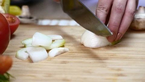 Cook cuts onions Stock Footage 78057483