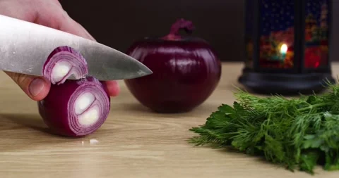 Cook cuts onions Stock Footage 130775721