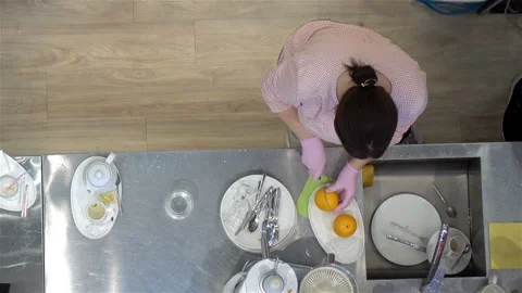 Cook cuts oranges. View from above. Stock Footage 120732159