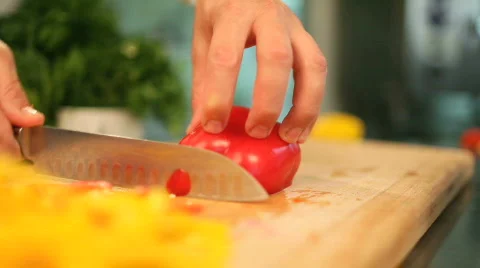 The cook cuts pepper Stock Footage